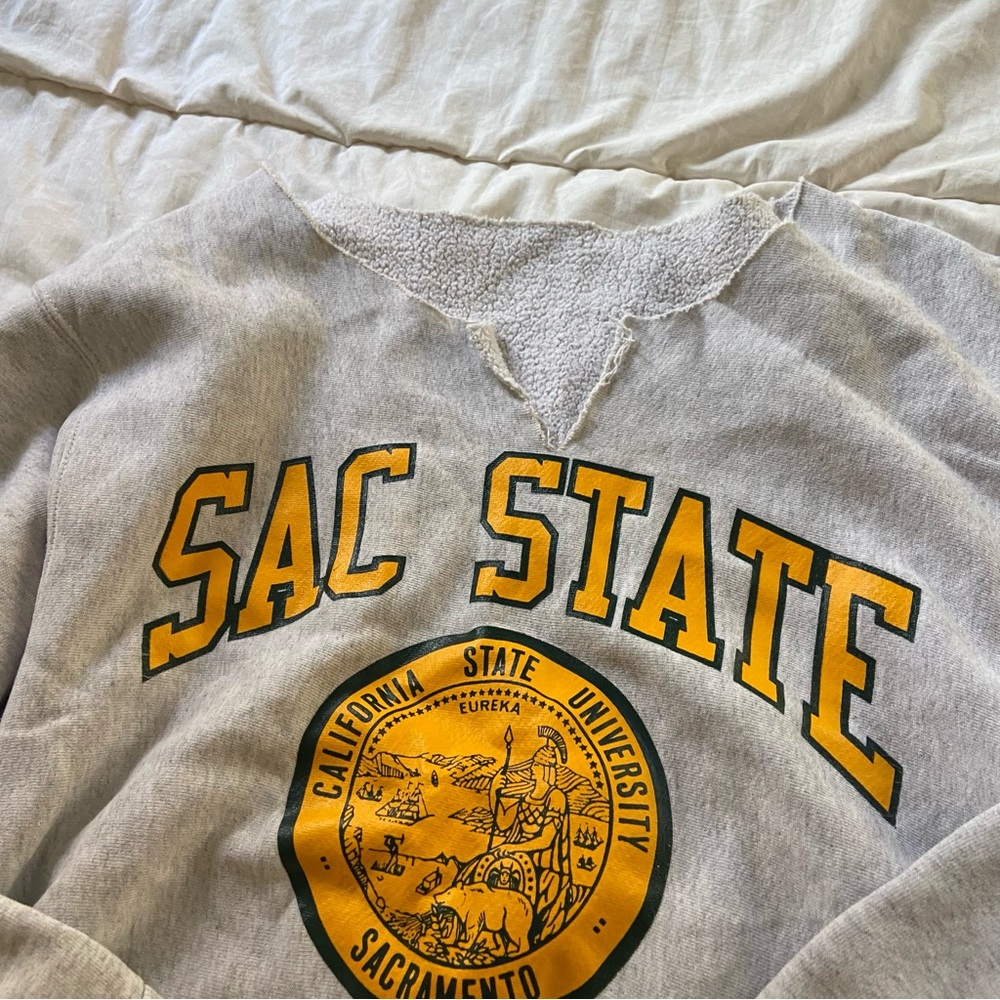 Grey and yellow Sacramento State University crewneck sweatshirt cut shoulder